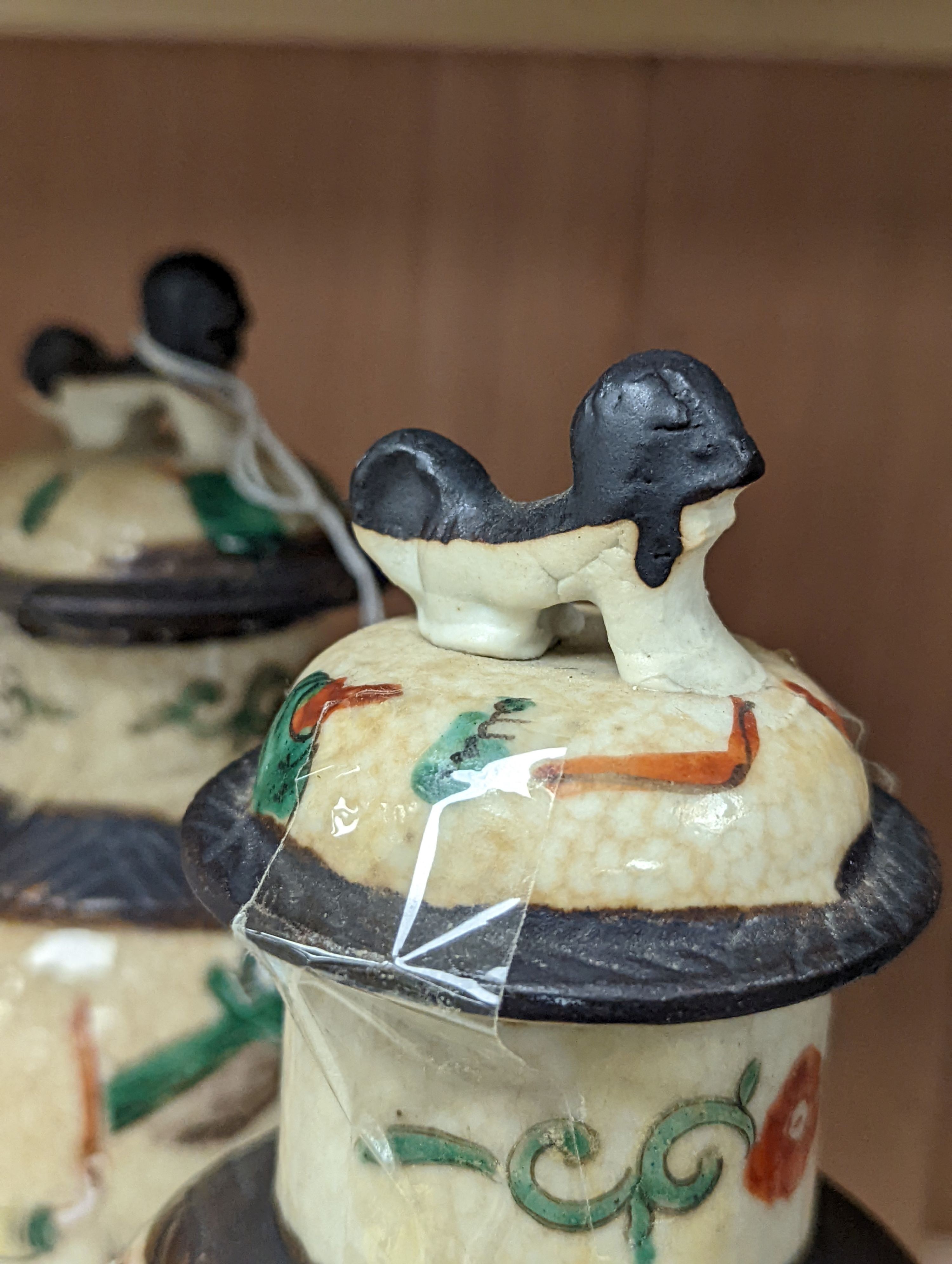 A pair of Chinese famille rose crackle glaze baluster jars and covers, 27cm.